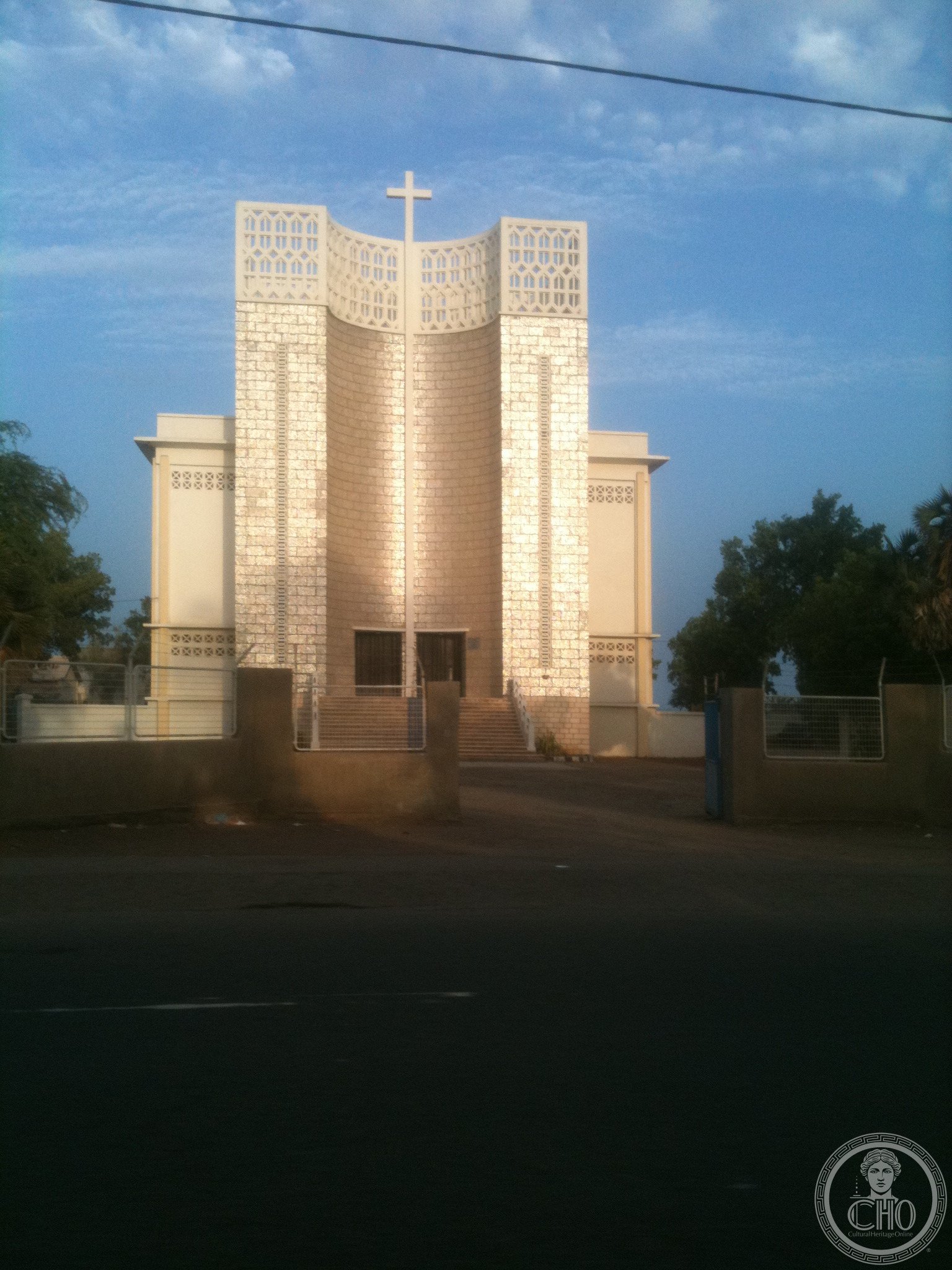 Our Lady of the Good Shepherd Cathedral in Djibouti City, a modernist white concrete church with twin pierced-lattice towers curving to a central cross