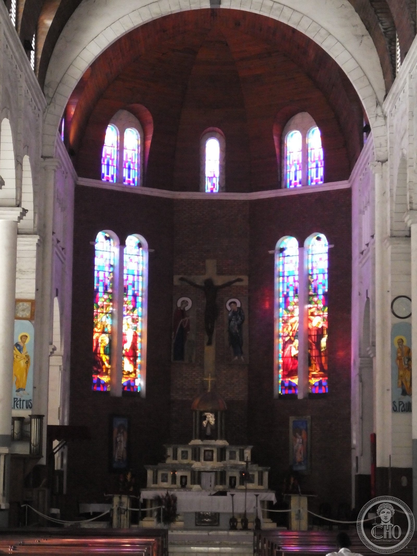 Interior of the Cathedral of Saints Peter and Paul in Douala, Cameroon, with icons labeled S. Petrus and S. Paul flanking the apse