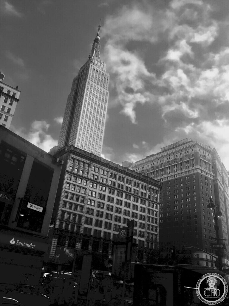 The Empire State Building in black and white, seen from the street
