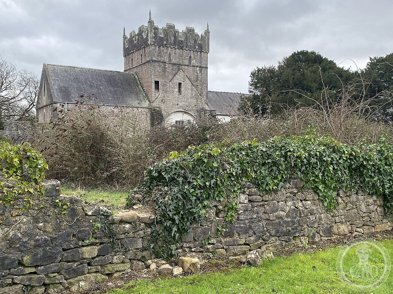 Ewenny Priory in Wales, founded 1141 by Maurice de Londres as a Benedictine daughter house of Gloucester, ringed by fortified precinct walls, gatehouses and mural towers built to defend against Welsh raiders