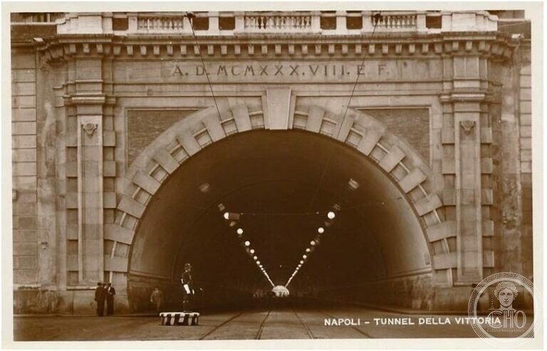 1930s postcard of the Galleria della Vittoria portal in Naples with tram tracks and a traffic policeman