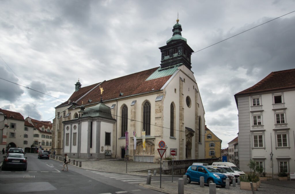 Graz Cathedral: Frederick III’s court church, its south wall still bearing the fresco of the three plagues of 1480