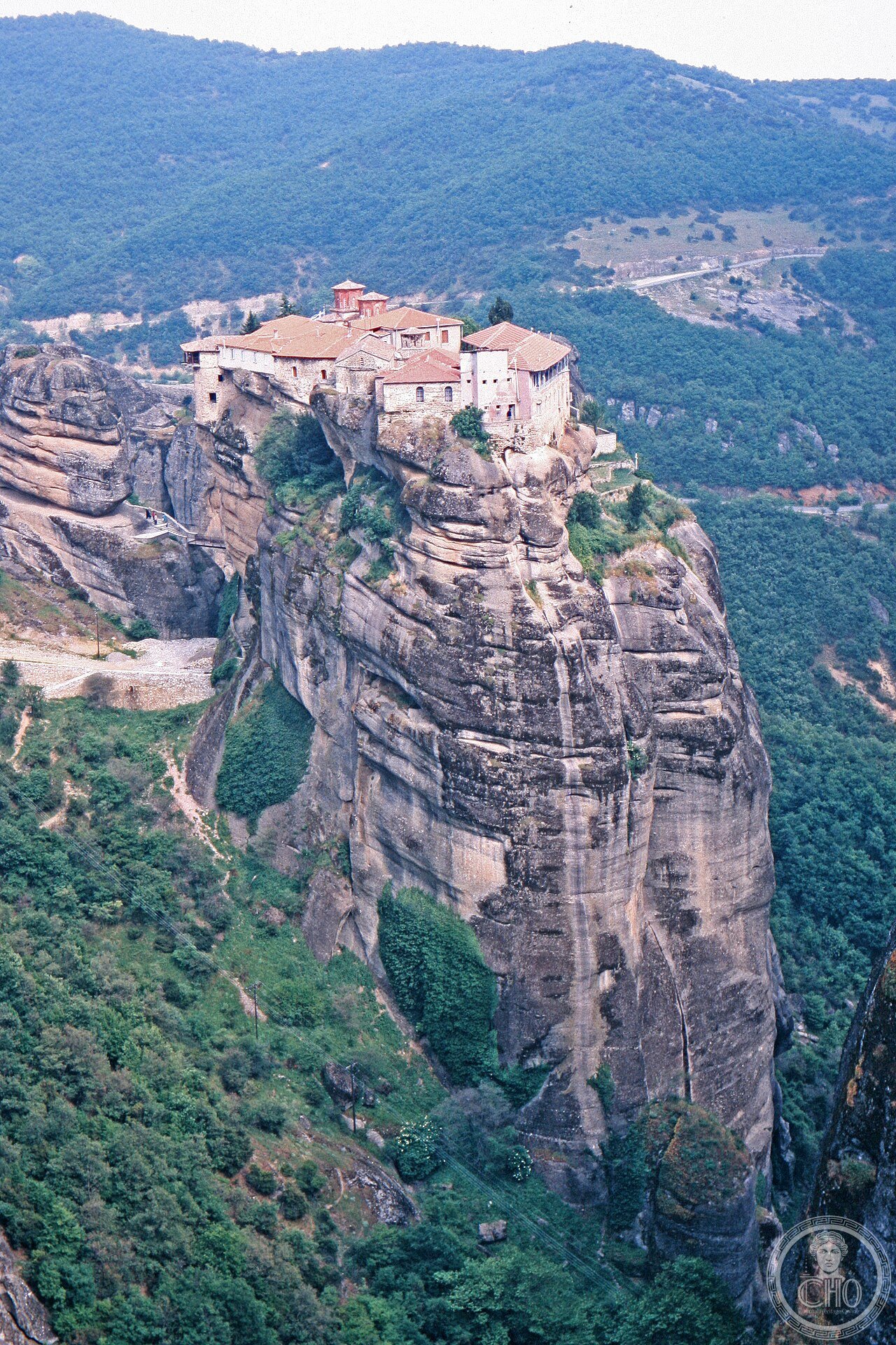 Wide exterior view of the Monastery of the Holy Trinity perched on its rock pinnacle at Meteora, Greece, founded 1475-1476, featured in the 1981 James Bond film For Your Eyes Only