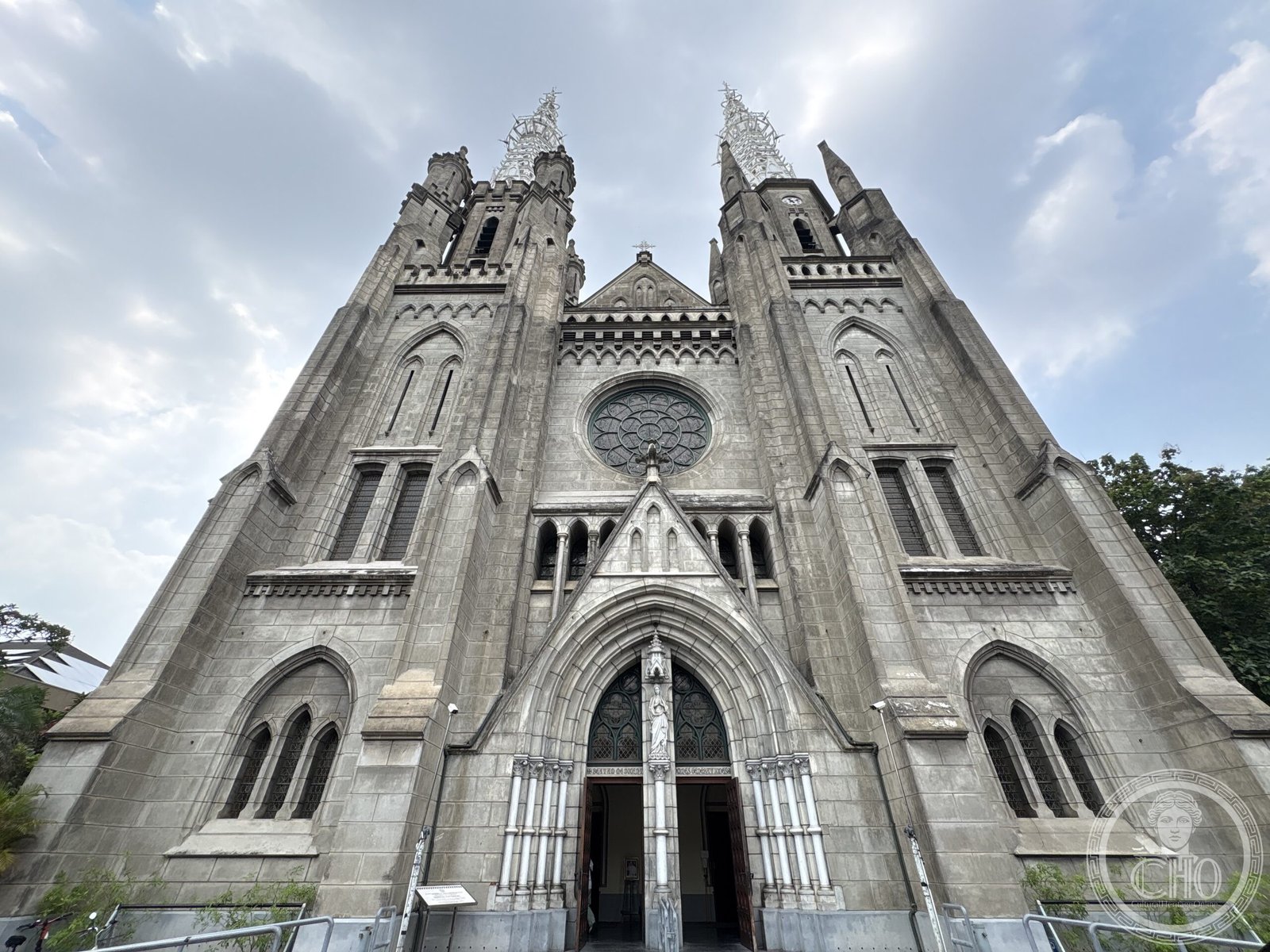 Jakarta Cathedral, Indonesia, a neo-Gothic facade with twin openwork iron spires and a rose window