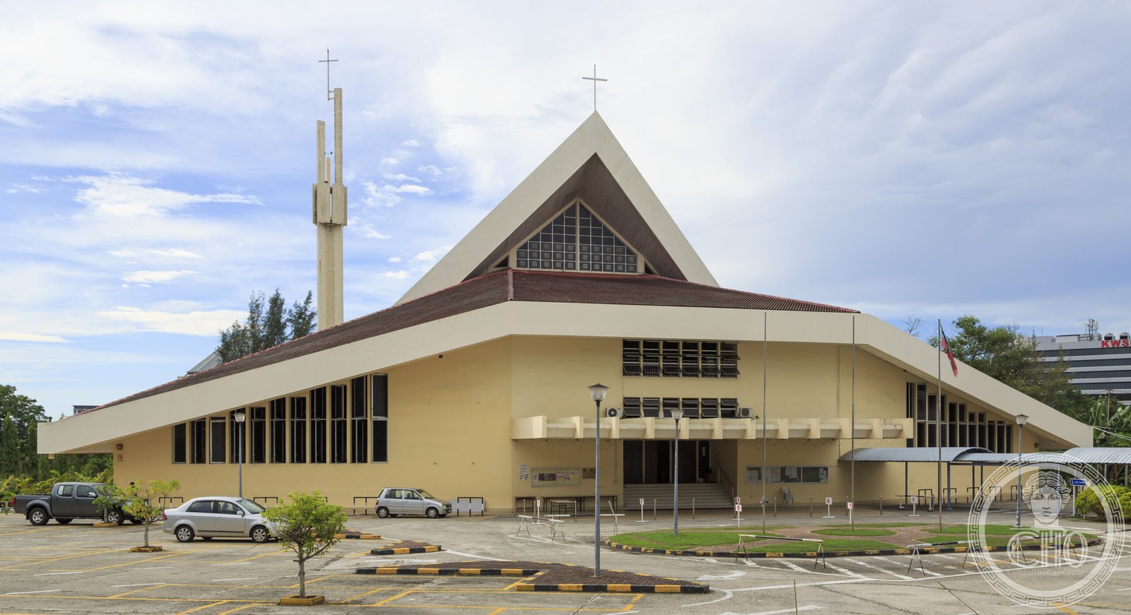 Sacred Heart Cathedral in Kota Kinabalu, Sabah, Malaysia, a modern A-frame church with a tall freestanding twin-cross bell tower