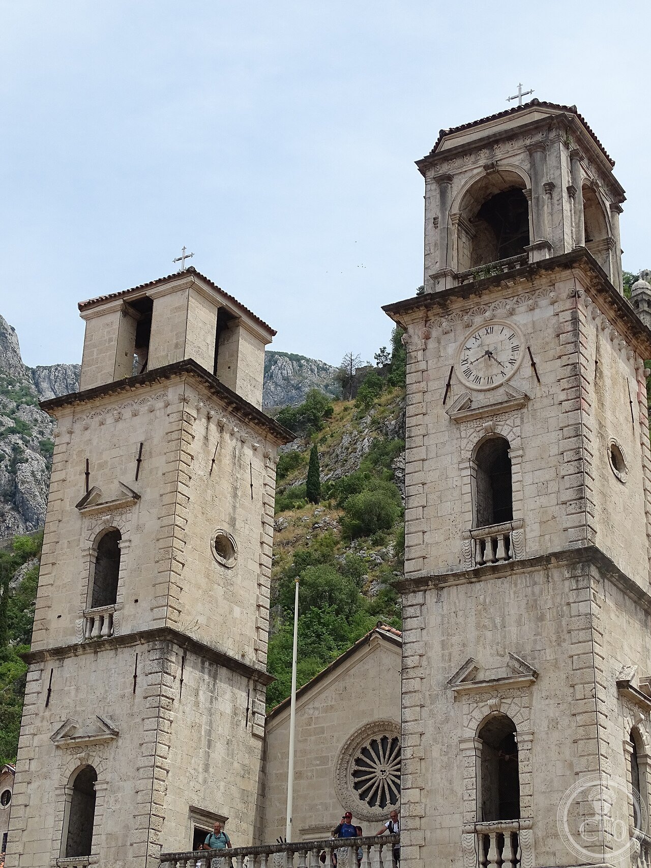 Cathedral of Saint Tryphon in Kotor, Montenegro, consecrated 1166, built to house relics that were originally being shipped to Dubrovnik for sale until a storm forced the vessel into Kotor's bay, one of whose Baroque bell towers remains unfinished after the 1667 earthquake