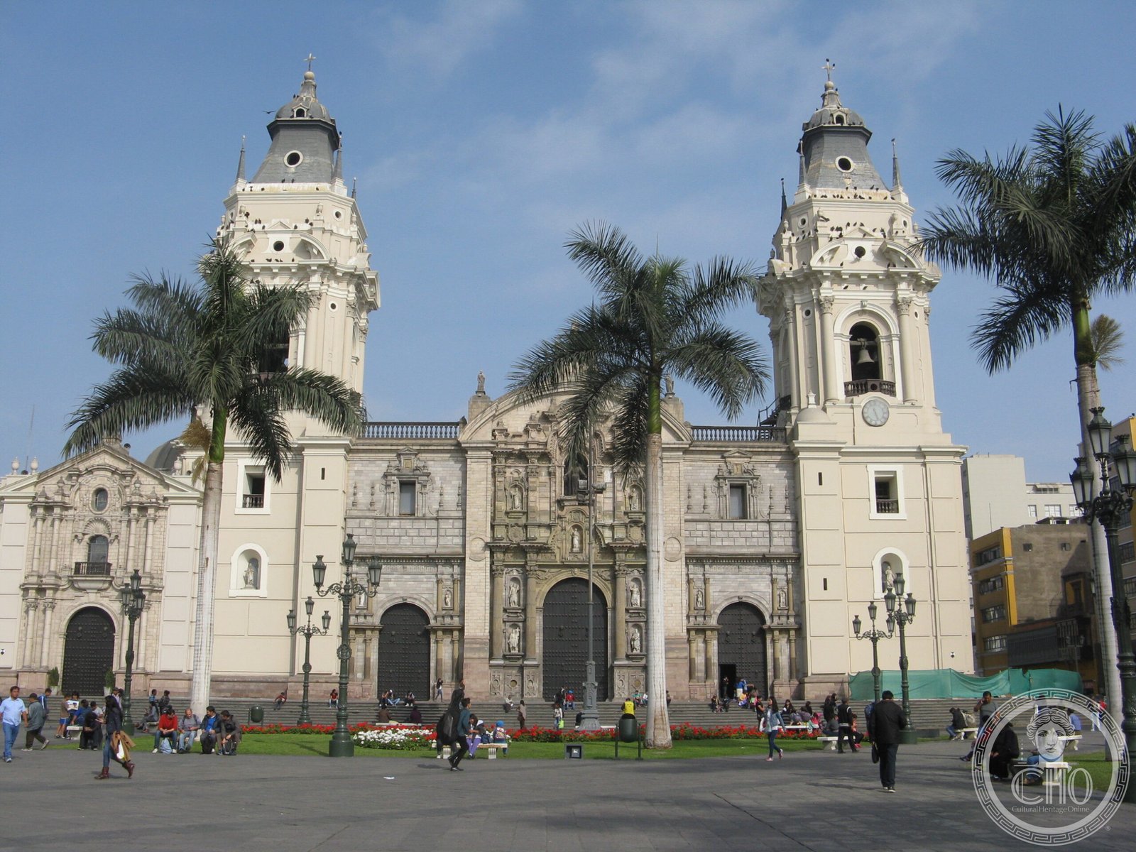 Basilica Cathedral of Lima, Peru, a cream-colored facade with twin bell towers and three main doors, facing the Plaza Mayor