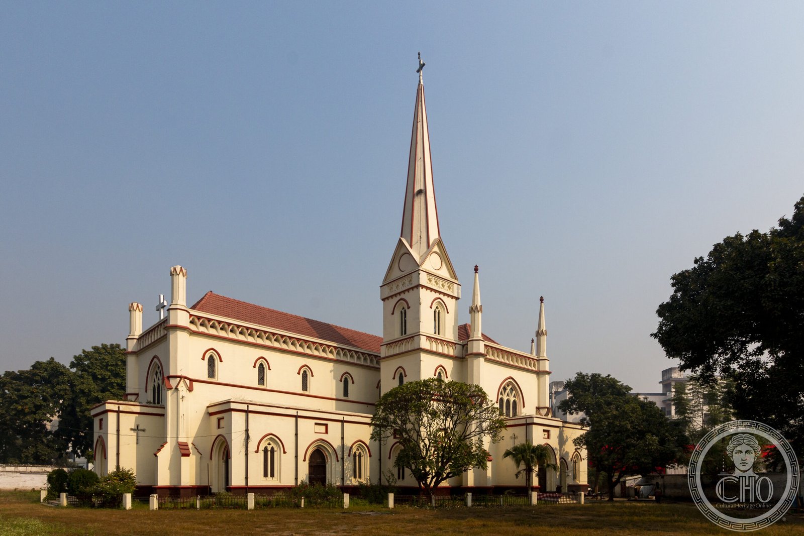 Christ Church in Lucknow, India, a cream-plastered Gothic Revival church with a tall spire and pinnacled turrets
