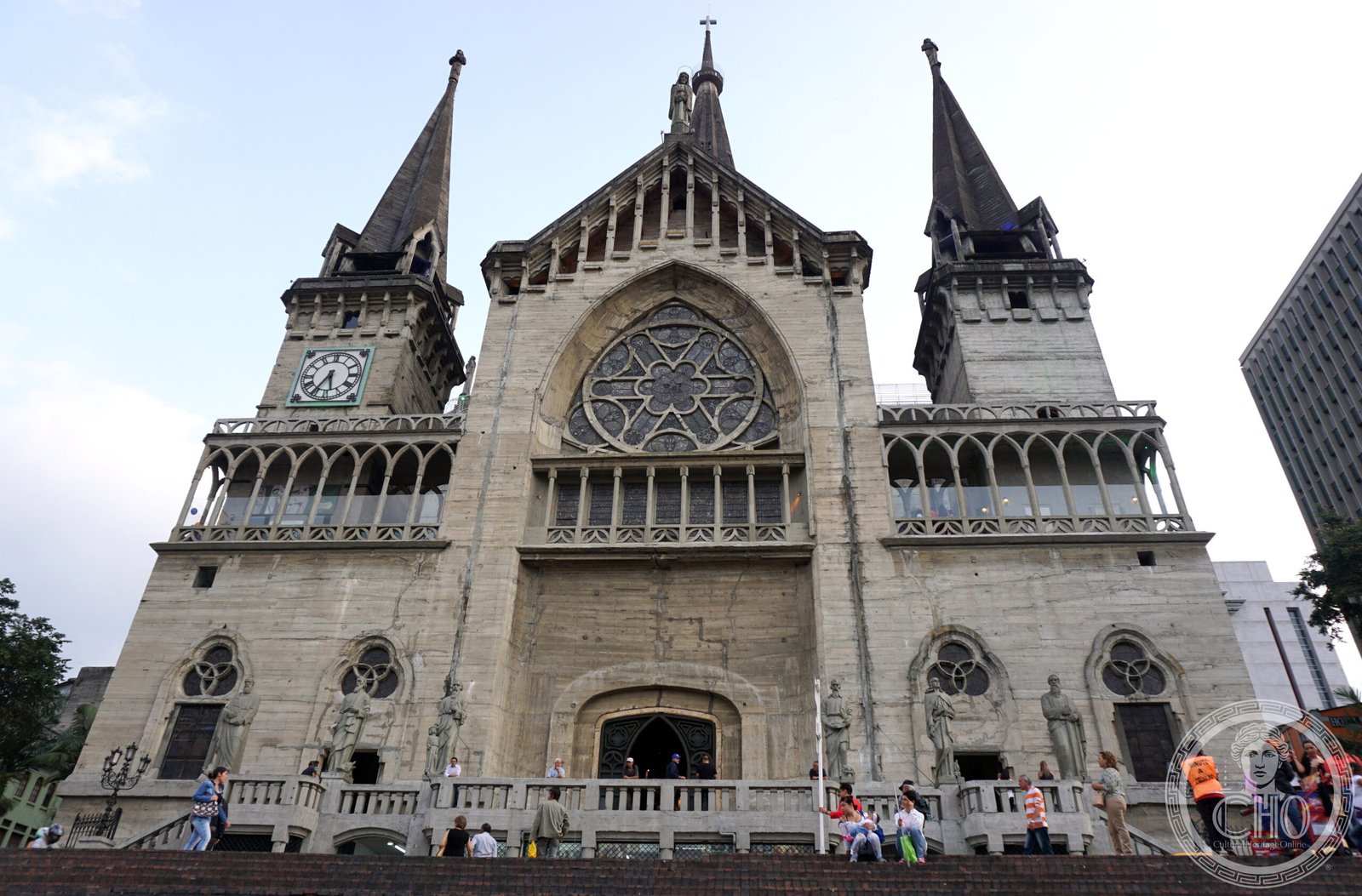 Cathedral Basilica of Our Lady of the Rosary in Manizales, Colombia, a grey exposed-concrete Neo-Gothic facade with a tall central tower