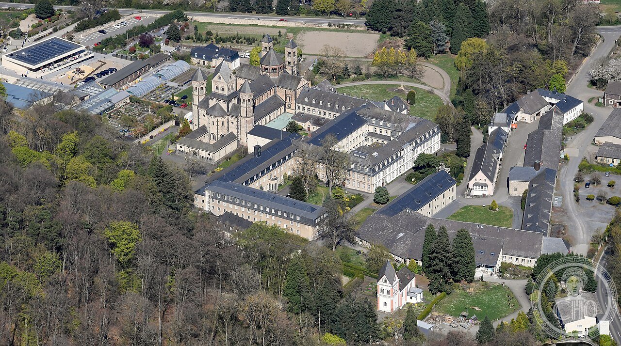Aerial view of Maria Laach Abbey and its volcanic caldera lake, Eifel region, Germany, founded 1093, built beside a volcano that erupted 12,900 years ago and remains active today