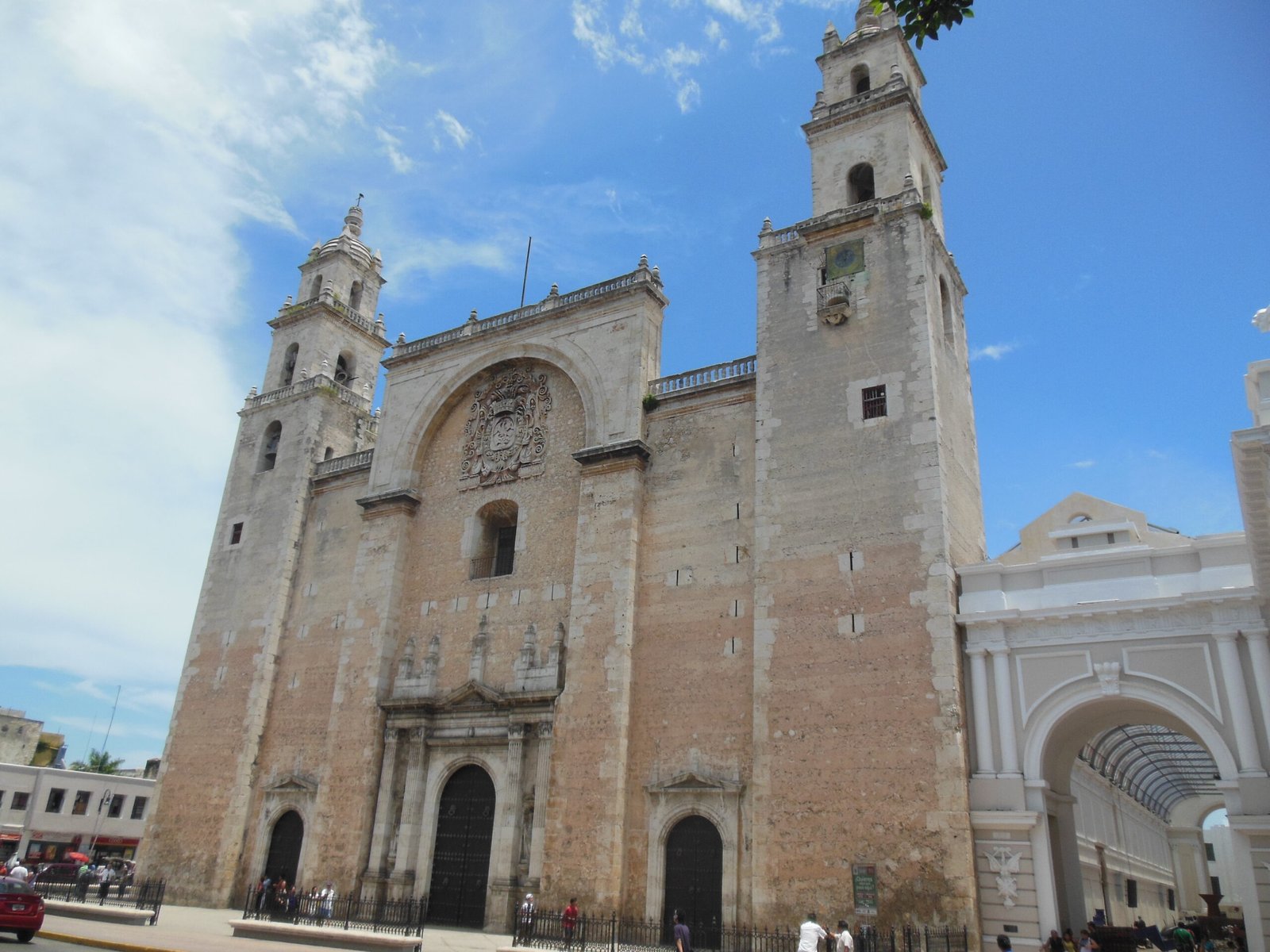 Renaissance stone facade of M&eacute;rida Cathedral, Yucat&aacute;n, Mexico, with its great triumphal arch between two massive towers