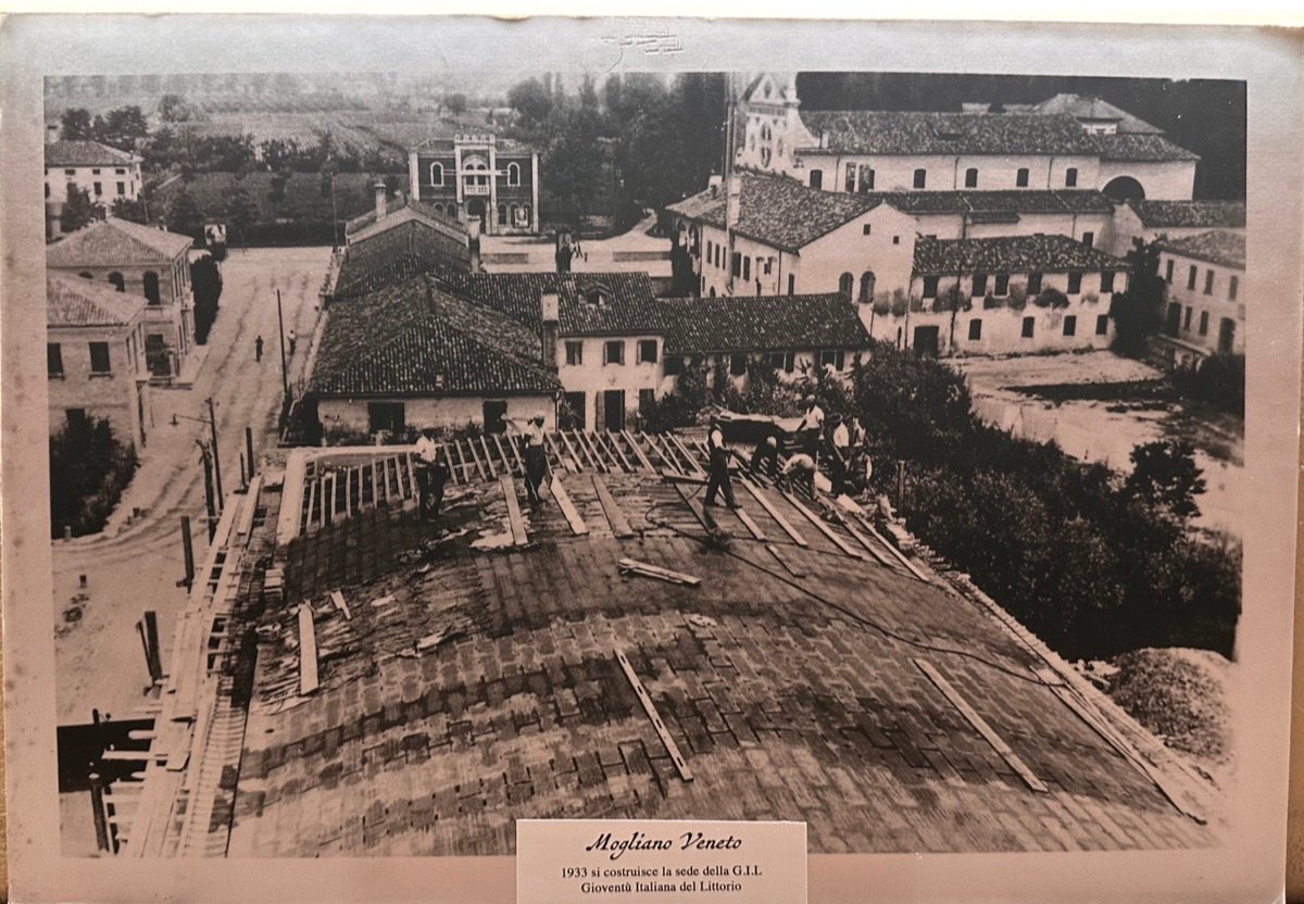 A building under construction at Mogliano Veneto in 1933, seen from above over the rooftops of the town centre