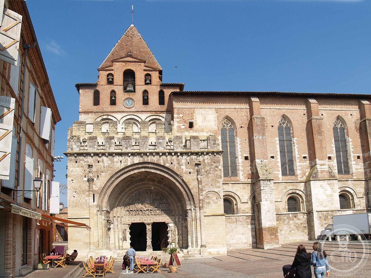 Facade of Saint-Pierre Abbey, Moissac, France, a Cluniac monastery whose south portal tympanum depicts Christ enthroned amid the 24 Elders of the Apocalypse, its cloister among the best-preserved Romanesque cloisters in the world