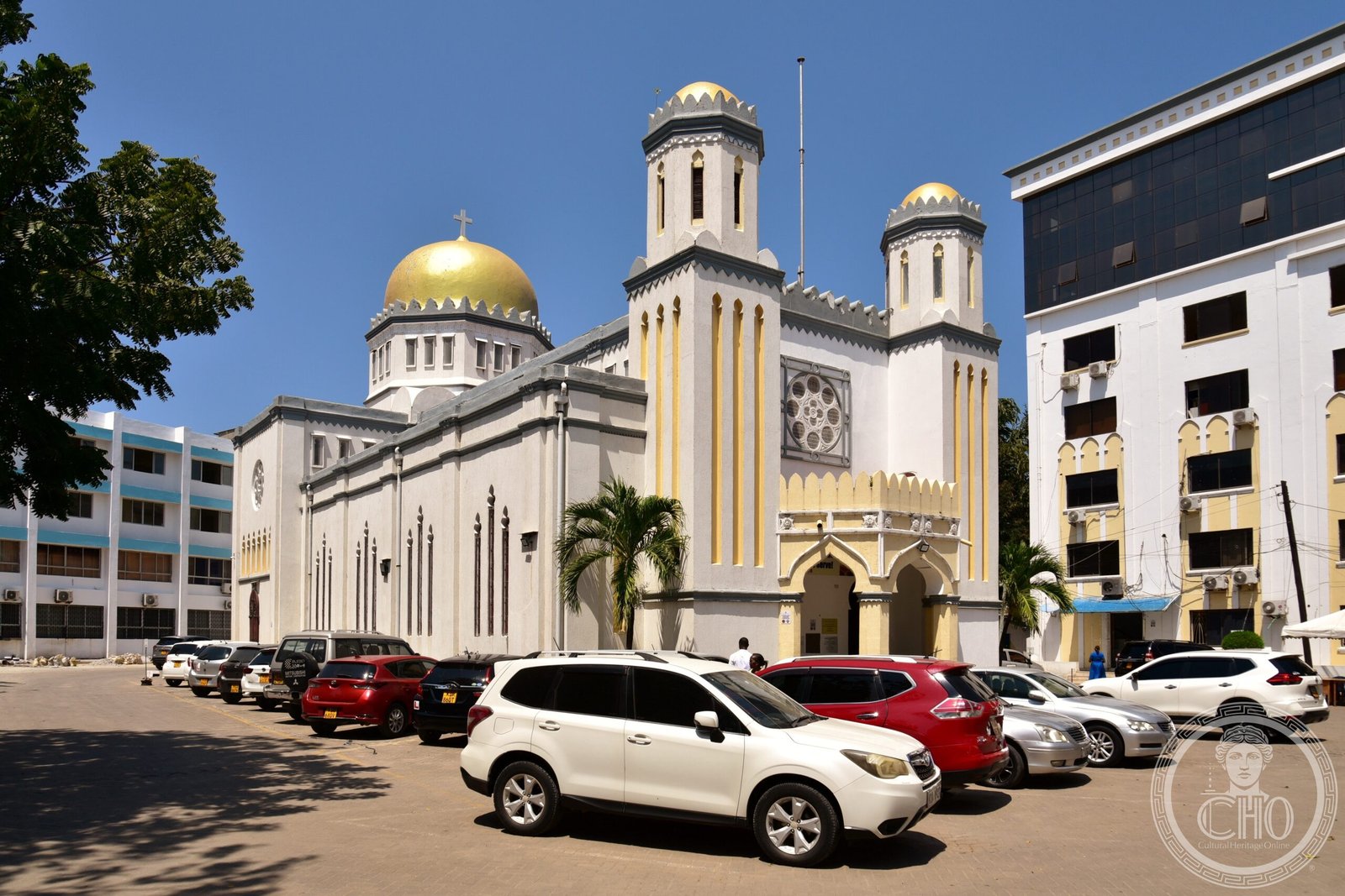 ACK Mombasa Memorial Cathedral in Kenya, a white church with a gold dome and twin minaret-like towers topped with crosses, built to echo local mosque architecture