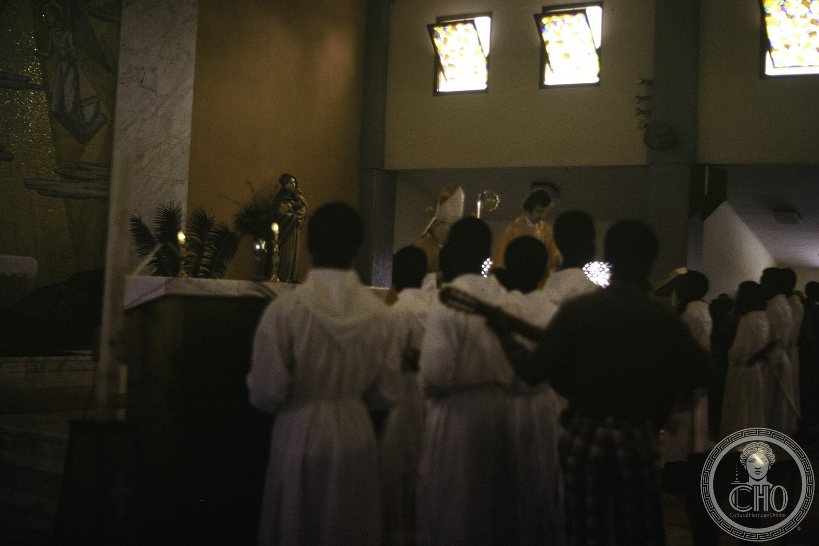 A Catholic bishop celebrates Mass inside Sacred Heart Cathedral, Monrovia, Liberia, in 1977, with a boys' choir in the foreground