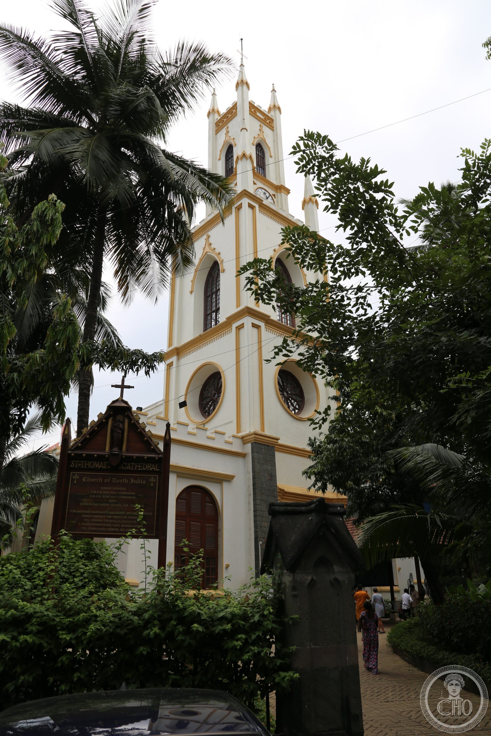 St. Thomas Cathedral in Mumbai, India, a white and gold Gothic bell tower with rose windows near Horniman Circle