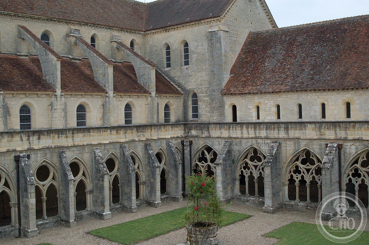 Cloister and abbey church of Noirlac Abbey, France, founded 1136 by twelve monks from Clairvaux on the banks of the Cher, one of the most complete and best-preserved Cistercian monasteries in France after serving as a porcelain factory and hospital