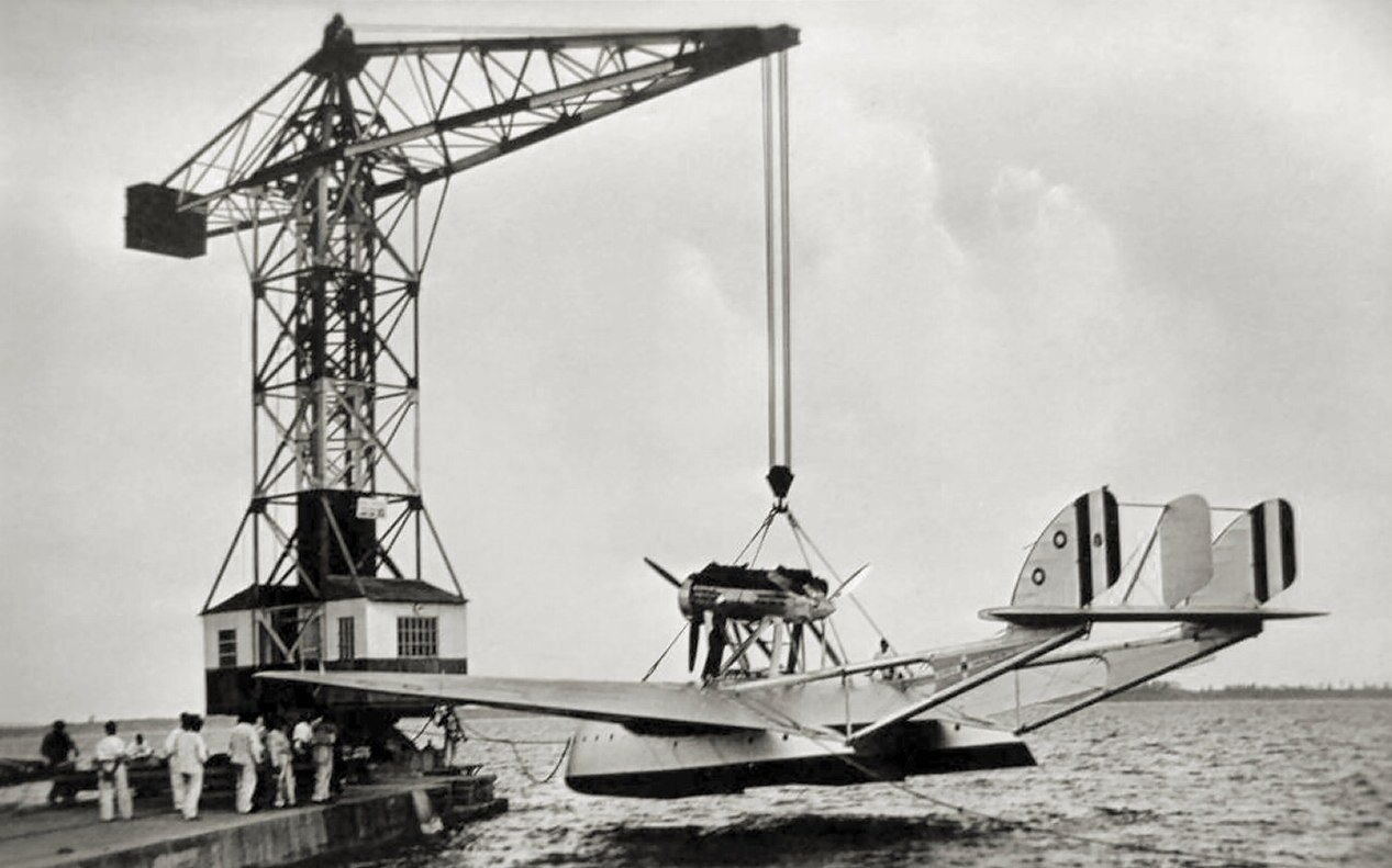 A Savoia-Marchetti S.55 flying boat craned into the lagoon at the Orbetello seaplane base