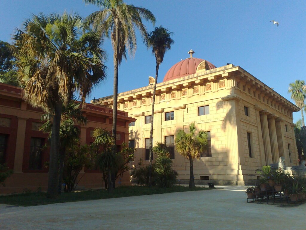Avenue of palms and tropical trees inside the Botanical Garden of Palermo