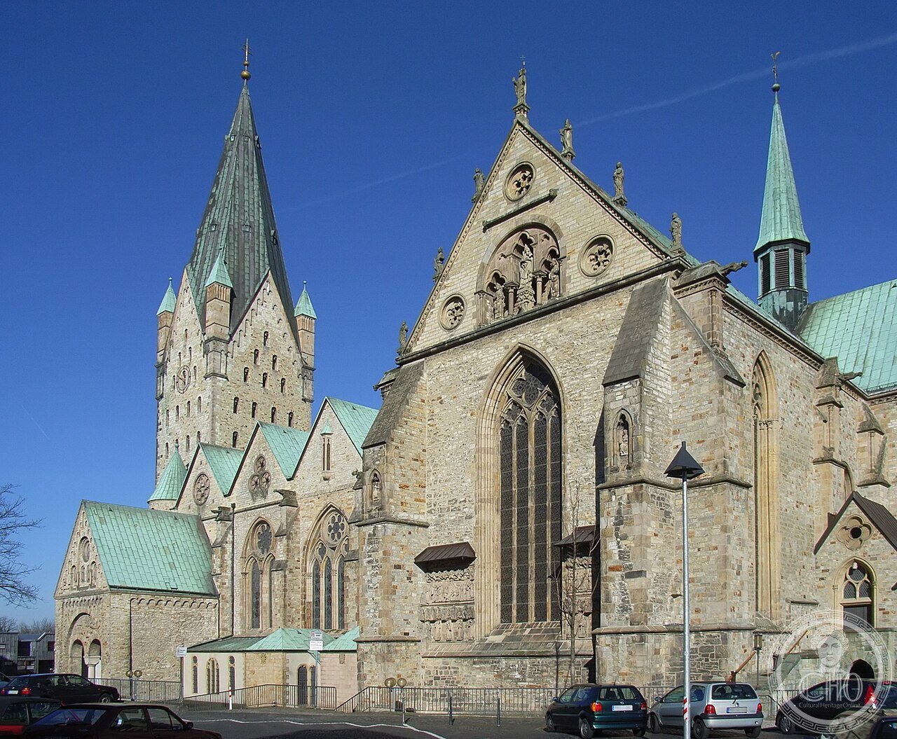 South side and tower of Paderborn Cathedral, Germany, standing over 200 springs of the river Pader, with a chapel dating to Charlemagne's 777 palace and the enigmatic Dreihasenfenster three hares window