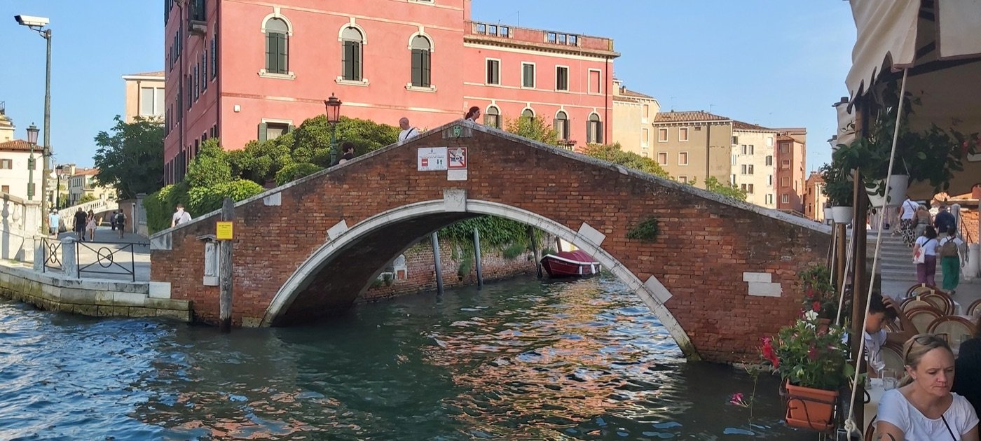 Ponte del Pagan — a 1933 Bridge on Venice’s Rio Novo — The brick arch of the Ponte del Pagan from the Rio Novo.