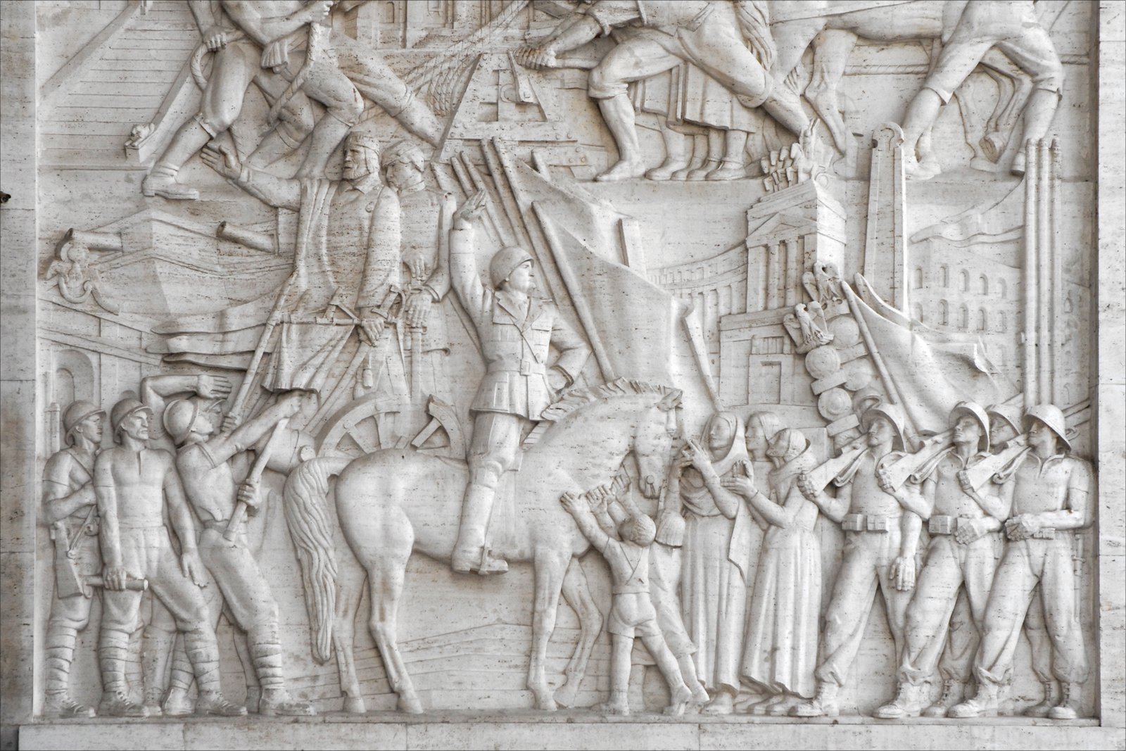 Publio Morbiducci travertine bas-relief at the entrance of the Palazzo degli Uffici.