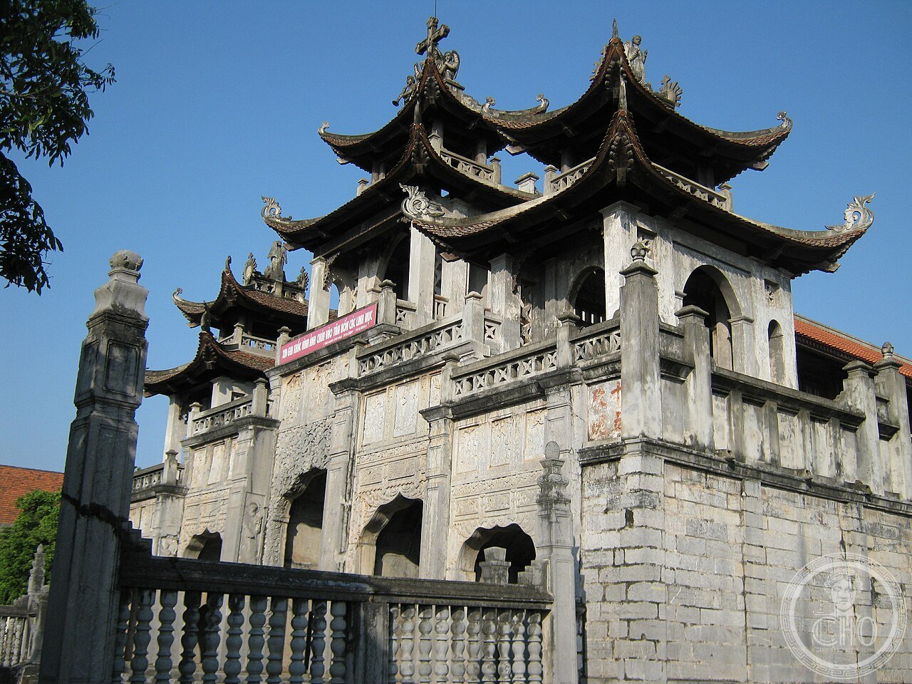 The Phương Đình bell tower gate of Phát Diệm Cathedral in Ninh Bình, Vietnam, a stone and ironwood Catholic complex built 1875-1899 in the form of a traditional Vietnamese communal house rather than European Gothic style