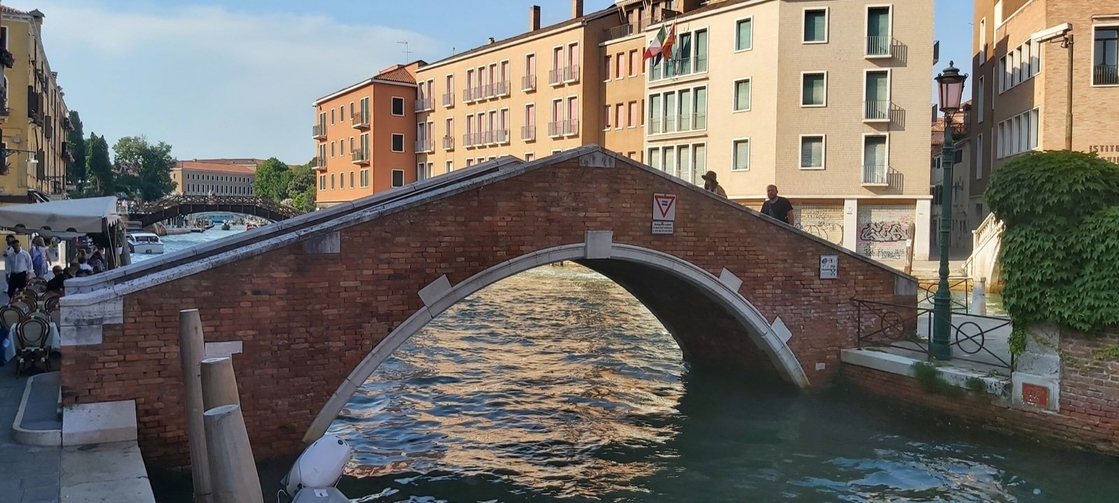 Brick single-arch Ponte del Pagan spanning a canal in Venice, with Istrian-stone bands
