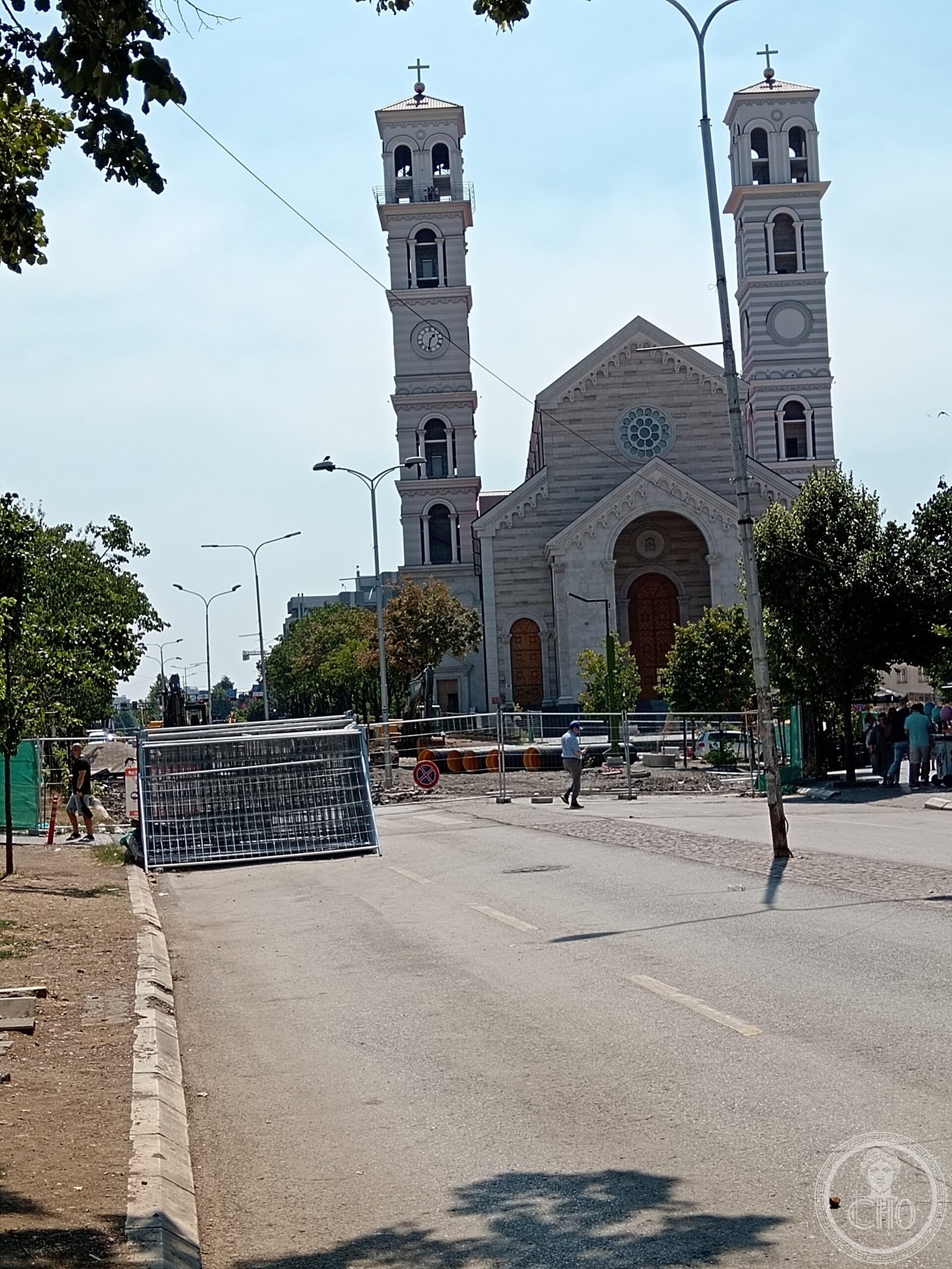 Cathedral of Saint Mother Teresa in Pristina, Kosovo, a neo-Romanesque cathedral built 2007-2017, with twin cream-and-pink-striped bell towers