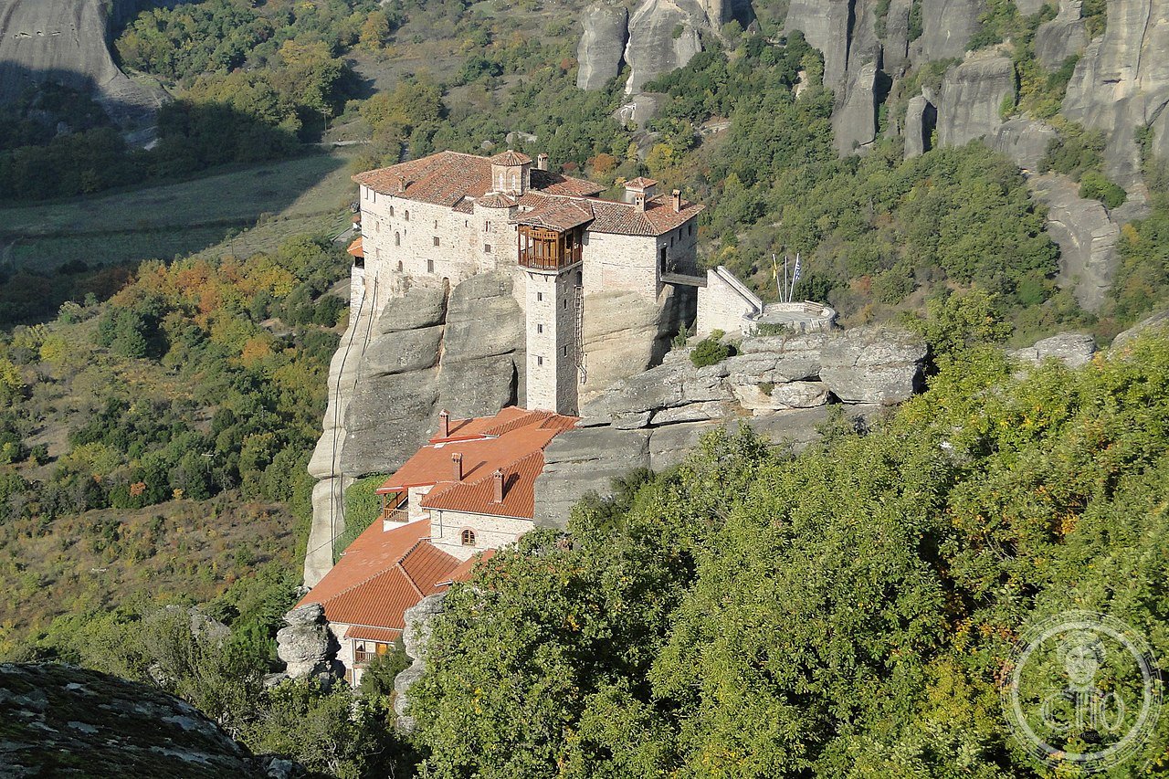Rousanou Monastery perched on its rock pinnacle at Meteora, Greece, founded 1545, plundered by German forces in 1940, and since 1988 home to a community of Orthodox nuns