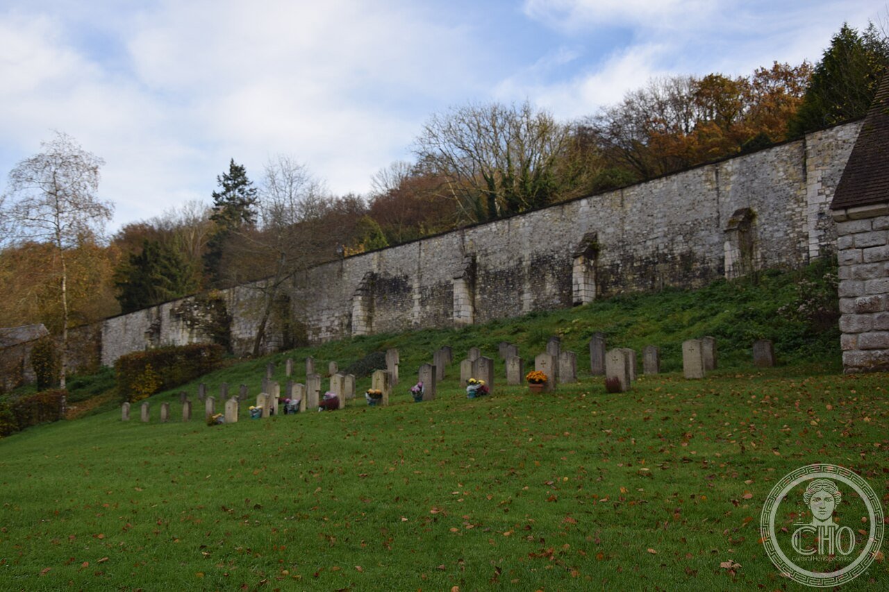 Ruins of the former Saint-Pierre abbey church at Saint-Wandrille Abbey, Normandy, France, founded 649, whose 1631 tower collapse was eventually replaced in 1969 by a relocated 13th-15th-century tithe barn from Eure