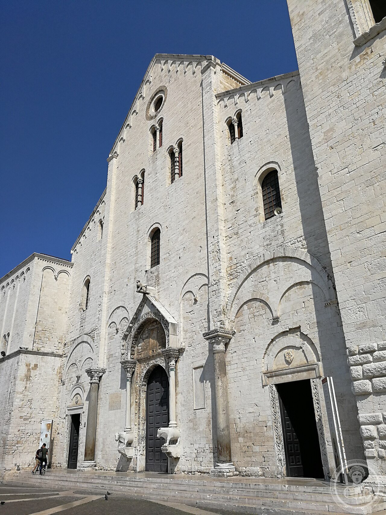 Facade of the Basilica of Saint Nicholas in Bari, Italy, built 1087-1197 to house the relics of Saint Nicholas of Myra, the historical basis for Santa Claus, and venerated equally by Catholic and Orthodox pilgrims