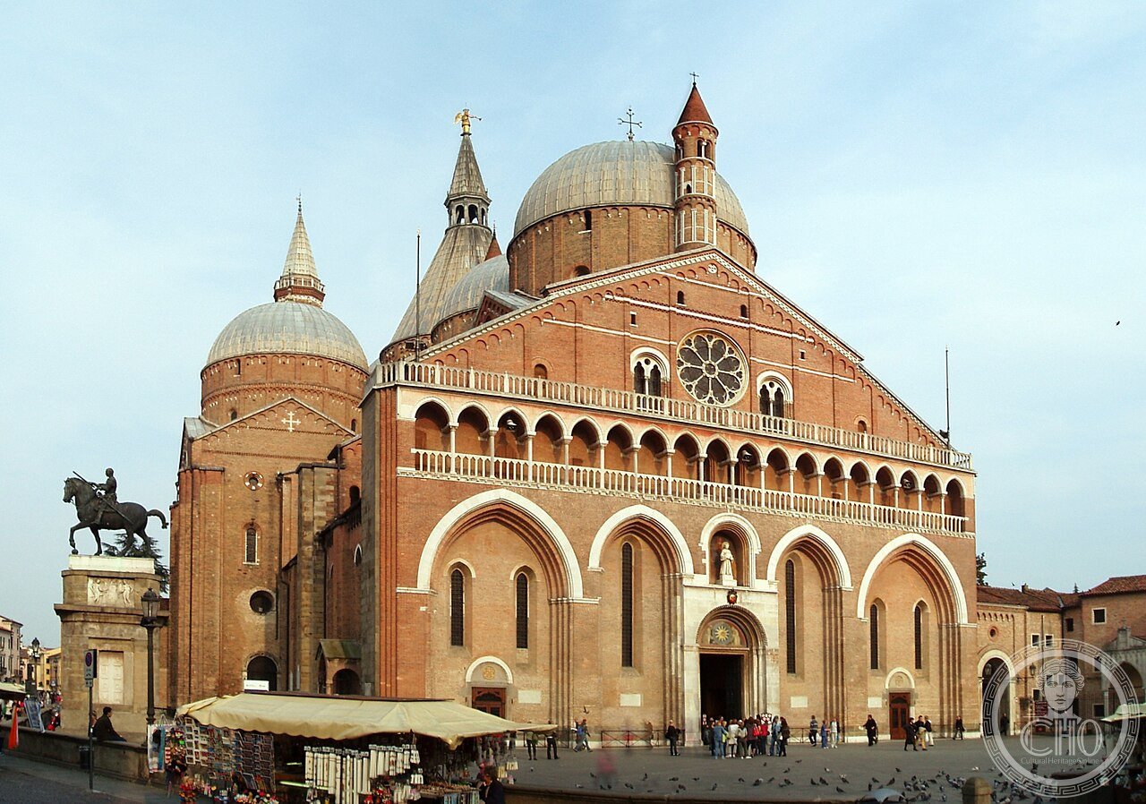 Wide exterior view of the Basilica of Saint Anthony in Padua, Italy, built 1232-1310, showing its eight Byzantine-style domes and twin 68-metre minaret-like bell towers