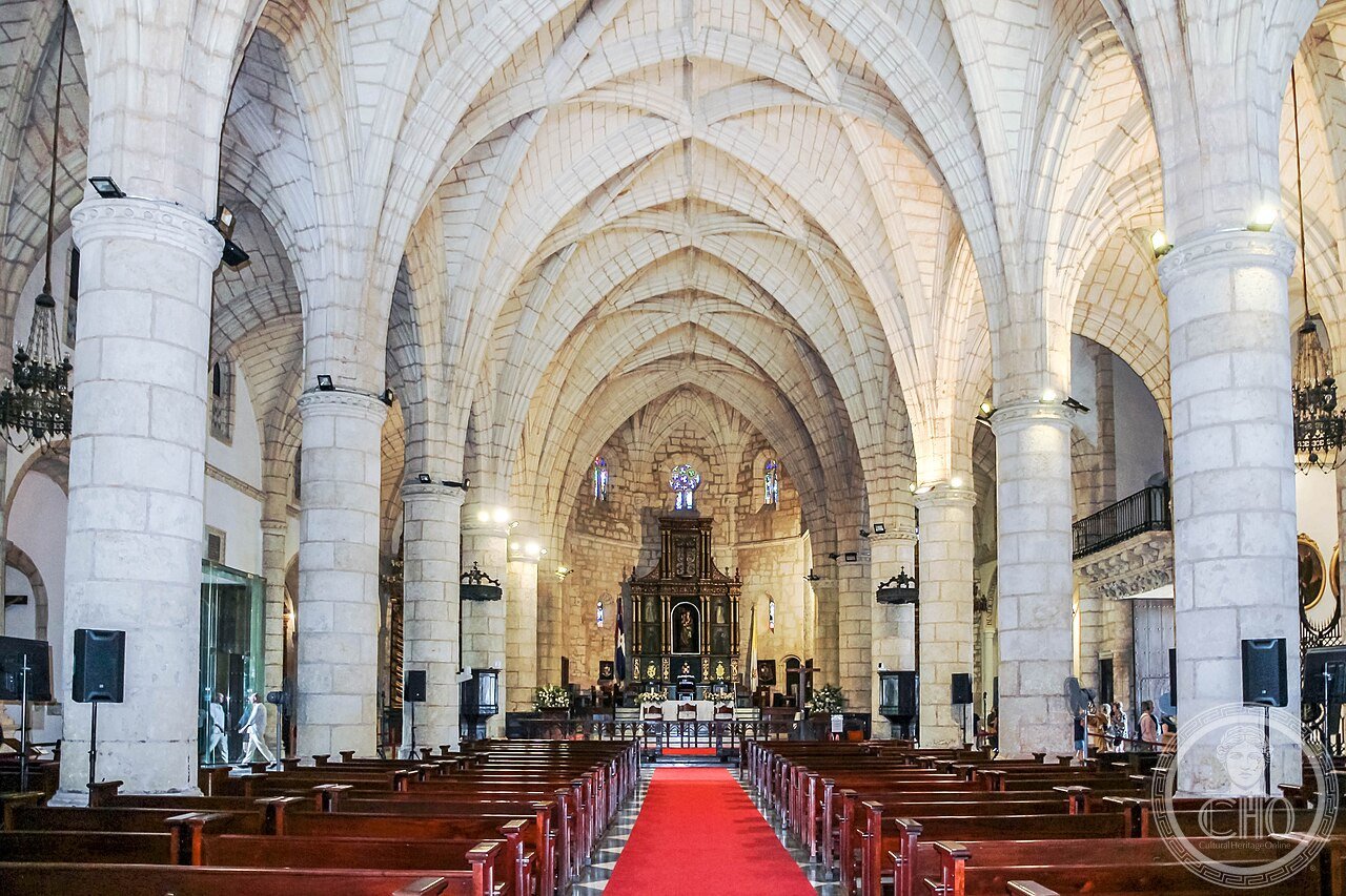 Interior of the Cathedral Primada de America in Santo Domingo, its coral-stone Gothic ribbed vaults over the nave and high altar