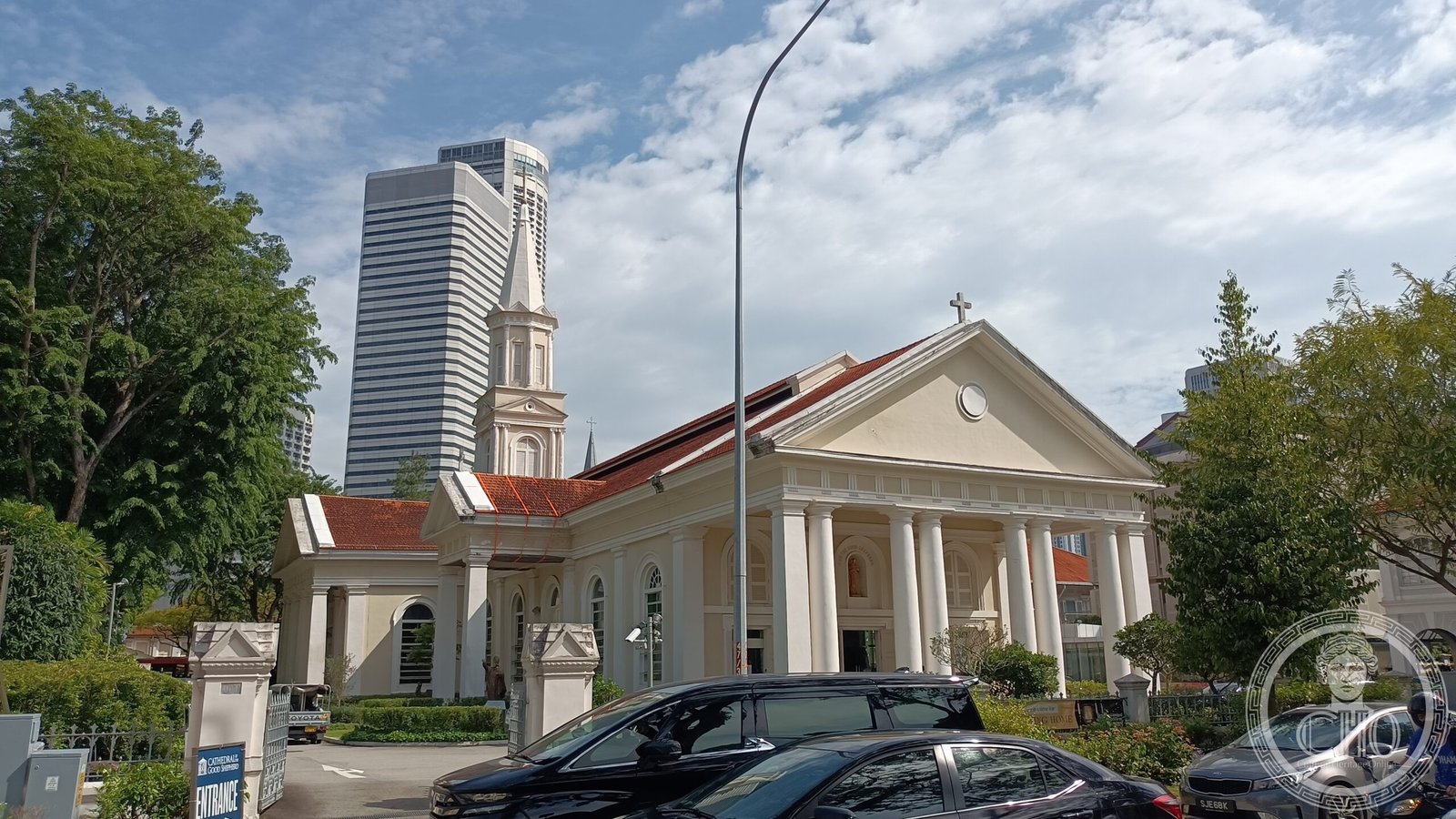 Cathedral of the Good Shepherd in Singapore, a cream neoclassical facade with a white Ionic-columned portico and tall spire