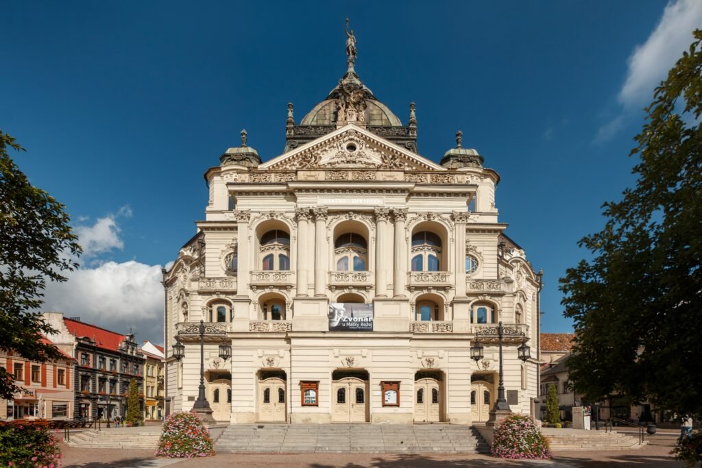 The Neo-Baroque State Theatre of Košice seen across the main square at dusk