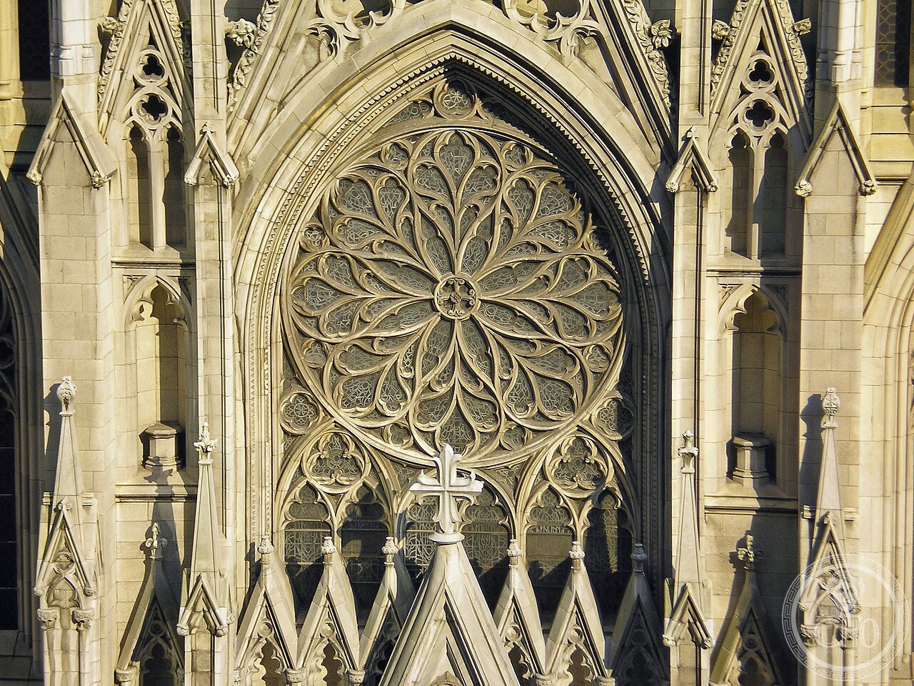 St. Patrick's Cathedral on Fifth Avenue, New York City, a white marble Gothic Revival cathedral built 1858-1888, once mocked as 'Hughes' Folly' for standing on the then-rural edge of the city