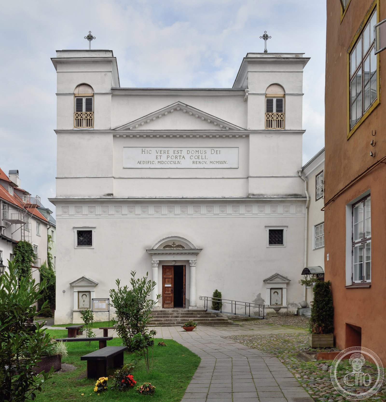 Cathedral of Saints Peter and Paul in Tallinn, Estonia, a white neoclassical twin-towered facade with a Latin inscription over the entrance