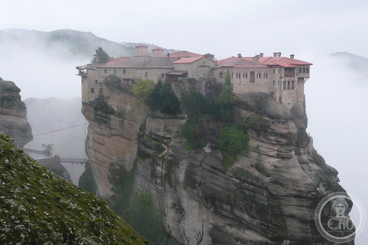 Wide exterior view of Varlaam Monastery perched on its rock pinnacle at Meteora, Greece, first settled by the hermit Varlaam c. 1350 and rebuilt by the Apsaras brothers in the 16th century
