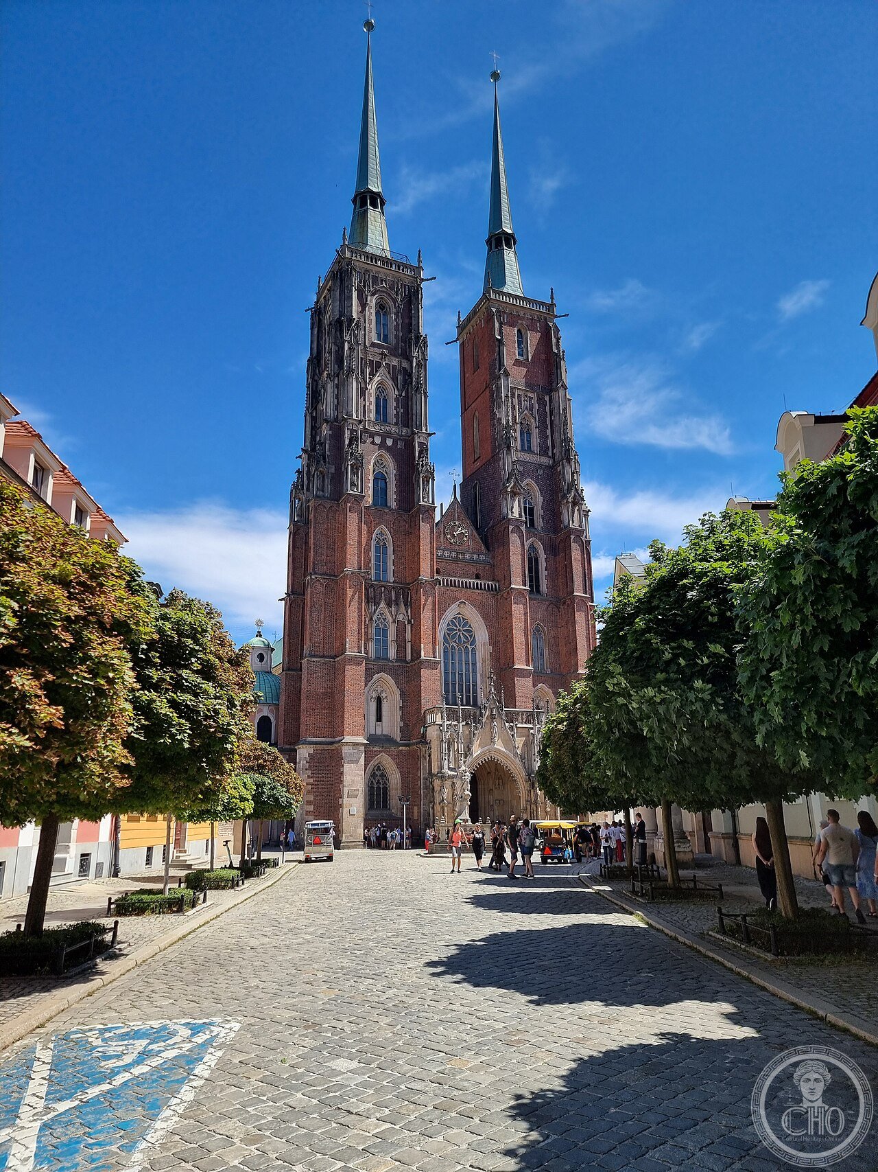 Wrocław Cathedral (St John the Baptist) in Poland, the fourth church on its site since the 10th century, roughly 70 percent destroyed during the 1945 Siege of Breslau and rebuilt over more than four decades, with its towers restored only in 1991