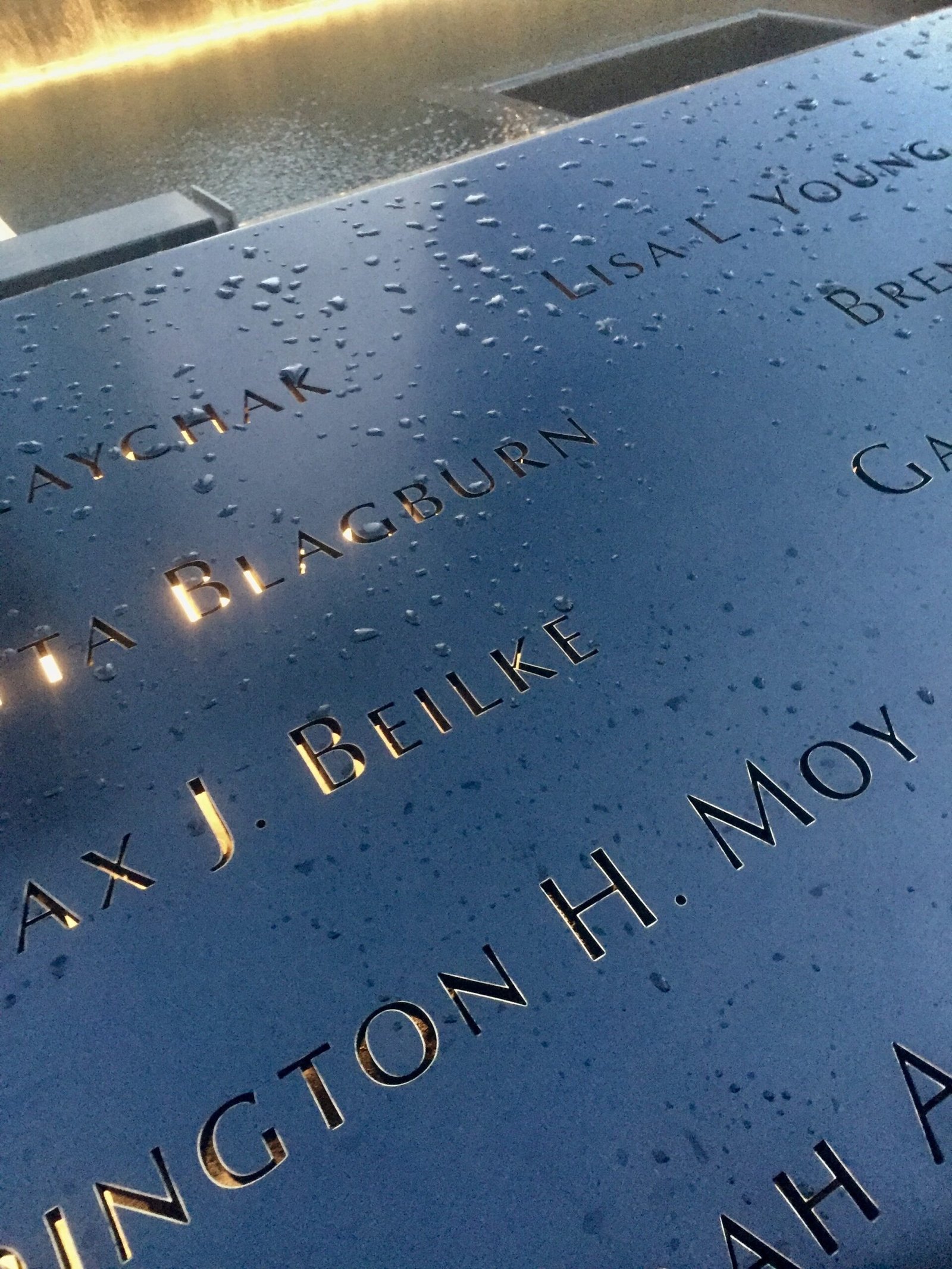Names inscribed on the bronze parapet.