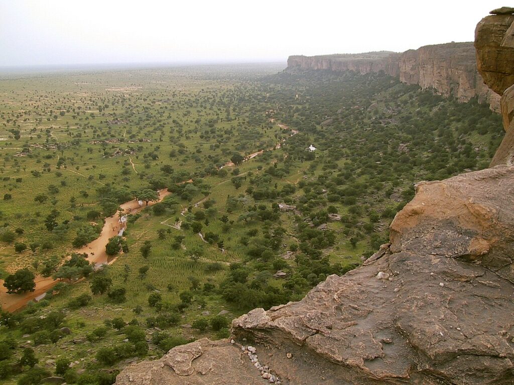 UNESCO World Heritage Sites Near the Bandiagara Escarpment: 500-Metre Dogon Cliffs, the Tellem Burial Caves and a Dama Ceremony That Only Initiates May Watch
