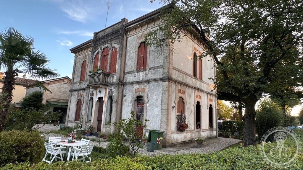 Side view of the villa showing the full volume and garden