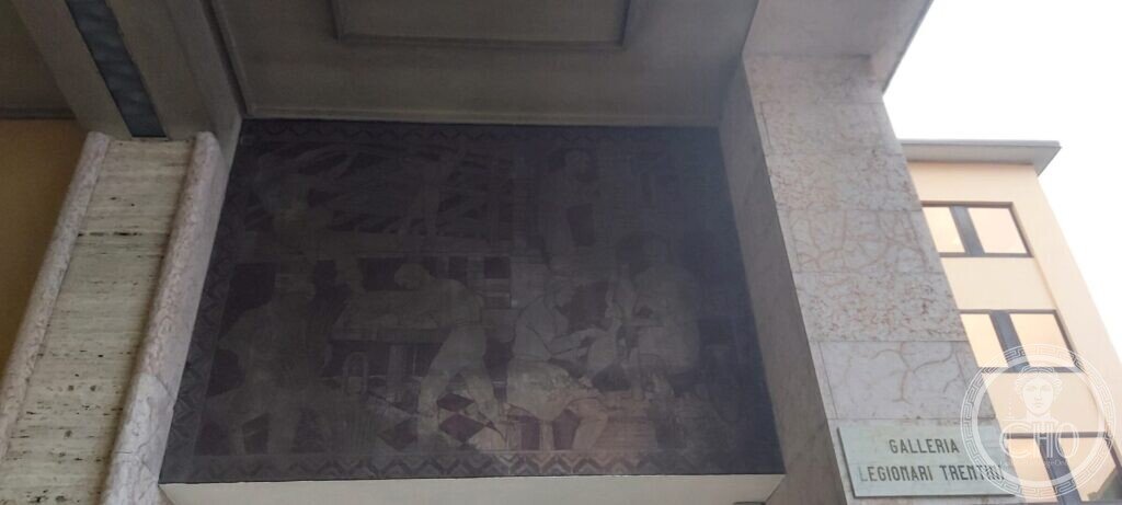 The painted lunette under the portico of the gallery, showing craft workers