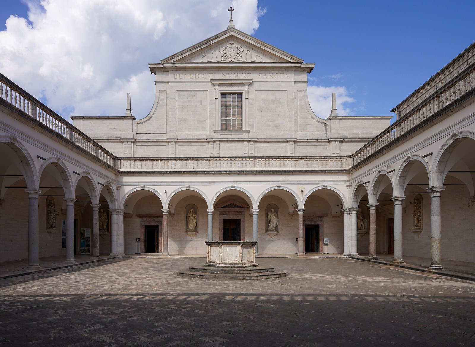 Facade of the basilica of Monte Cassino seen from the arcaded Cloister of the Benefactors