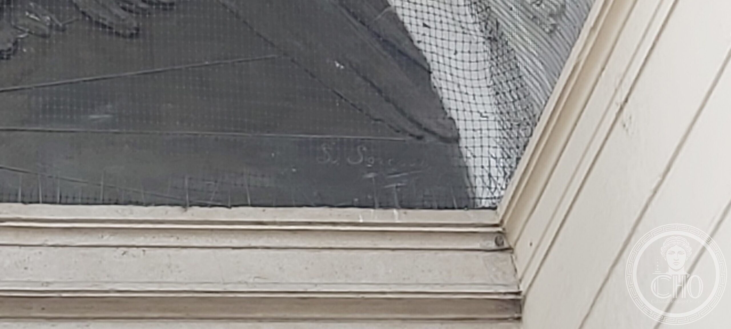 The sculptor's incised signature at the lower edge of the bronze lunette, Casa del Mutilato, Padua
