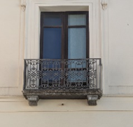 Detail of the scrolled ironwork of a balcony railing at Palazzo Alemanni, Catanzaro