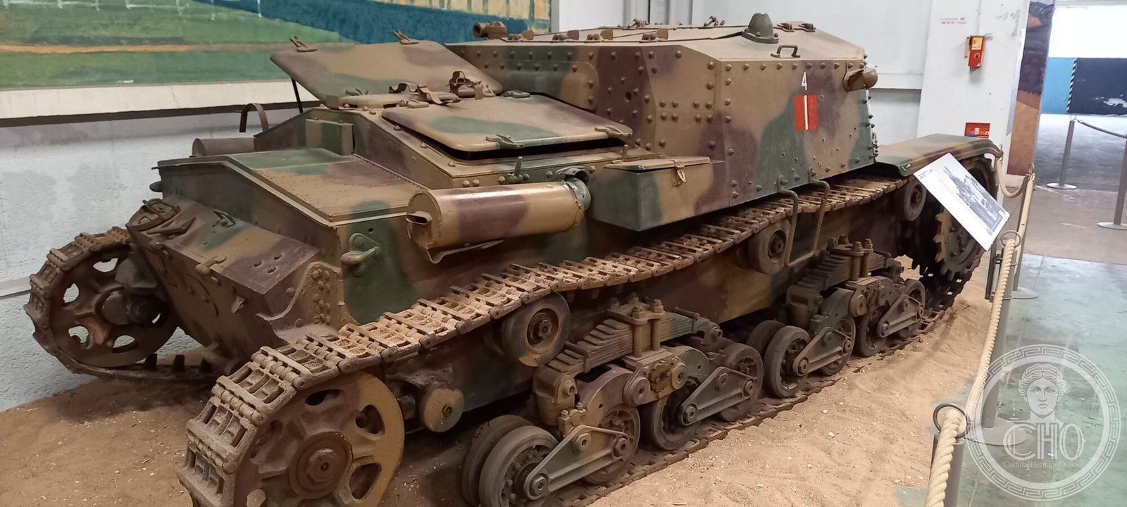 Three-quarter rear view of the Semovente, showing the engine deck, the riveted plates and the leaf-spring suspension