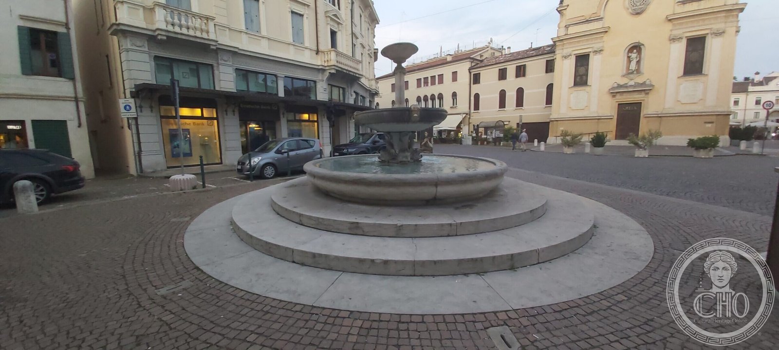 The fountain of Piazza San Leonardo with the facade of the church of San Leonardo on the right