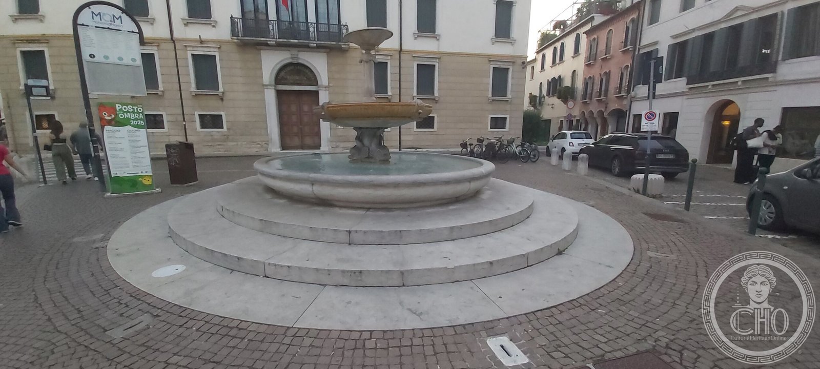 The marble fountain of Piazza San Leonardo in Treviso, three oval basins on a podium of steps, in the early evening